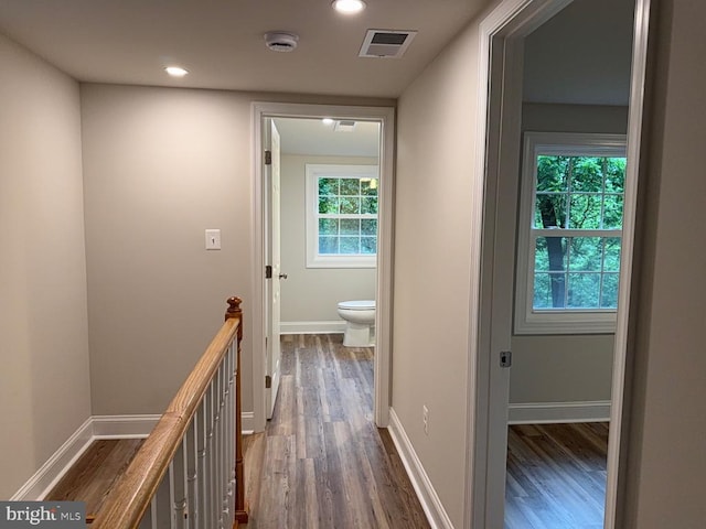  - hallway featuring dark wood-type flooring, an upstairs landing, and recessed lighting