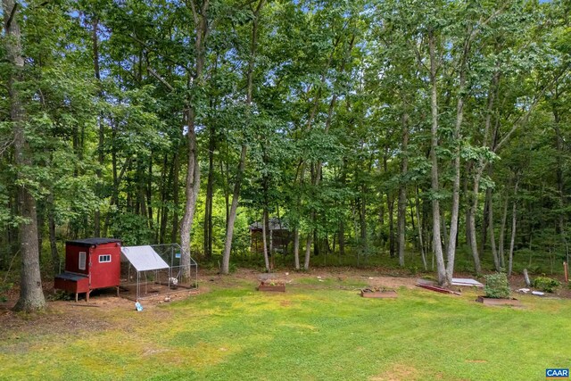 1409 Mica Rd, Mineral, VA 23117 - view of grassy yard with exterior structure and an outbuilding