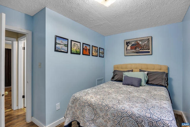 1409 Mica Rd, Mineral, VA 23117 - bedroom featuring wood finished floors and a textured ceiling