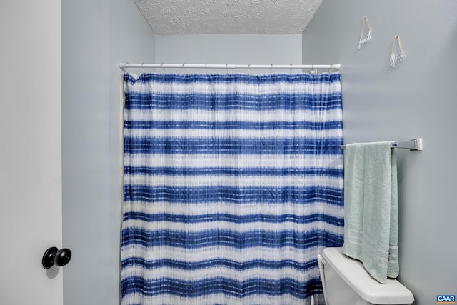 1409 Mica Rd, Mineral, VA 23117 - bathroom with a textured ceiling and a shower with curtain
