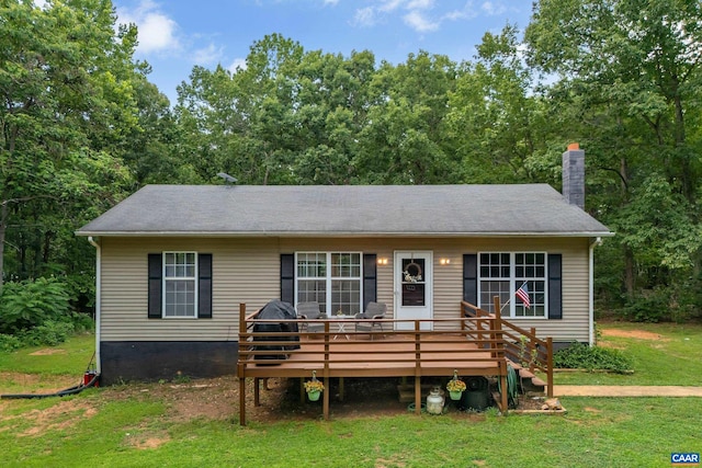 1409 Mica Rd, Mineral, VA 23117 - view of front of house with a front yard, a deck, and a chimney