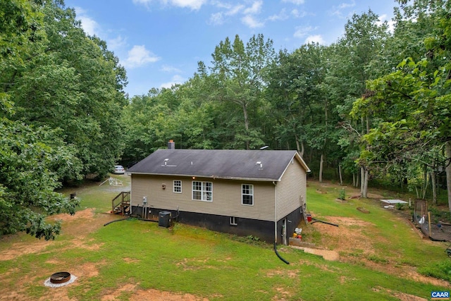 1409 Mica Rd, Mineral, VA 23117 - back of property featuring a yard, an outdoor fire pit, and a chimney