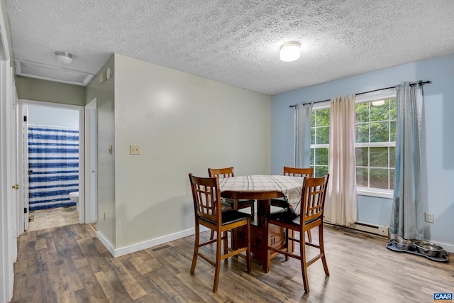 1409 Mica Rd, Mineral, VA 23117 - dining area with wood finished floors and a textured ceiling