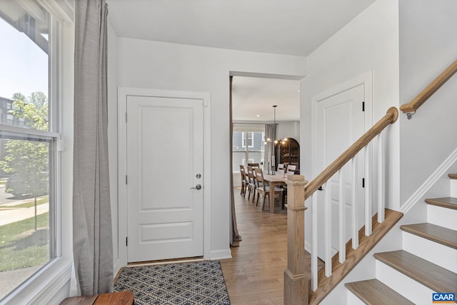 3190 Horizon Rd, Charlottesville, VA 22902 - foyer with light wood-style floors, stairs, a chandelier, and plenty of natural light