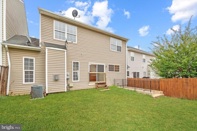 rear view of property featuring central air condition unit