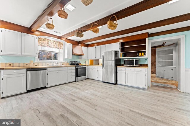133 Fairview Rd W, Culpeper, VA 22701 - kitchen with exhaust hood, appliances with stainless steel finishes, open shelves, light wood-type flooring, and beamed ceiling