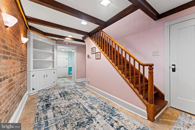 133 Fairview Rd W, Culpeper, VA 22701 - stairs featuring baseboards, ornamental molding, brick wall, and beamed ceiling