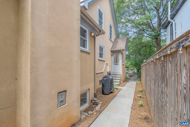 view of side of property featuring stucco siding