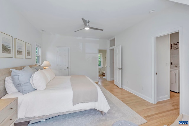 bedroom featuring light wood-type flooring, washer / clothes dryer, ceiling fan, and baseboards
