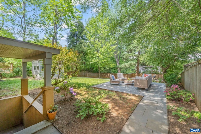 view of yard with an outdoor living space and a patio area