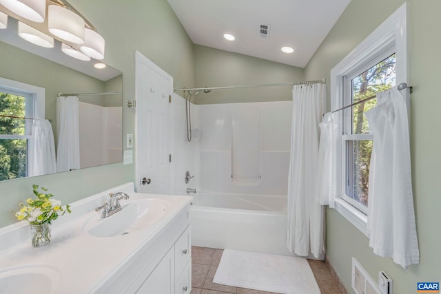 full bathroom featuring healthy amount of natural light, tile patterned floors, shower / bath combination with curtain, double vanity, and recessed lighting
