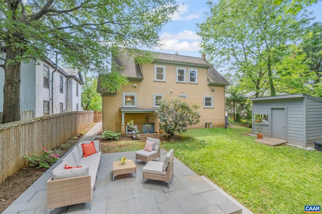 rear view of property featuring a patio area, stucco siding, an outdoor hangout area, an outdoor structure, and roof with shingles
