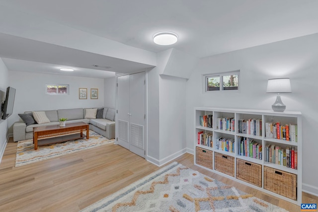 living room featuring wood finished floors and baseboards
