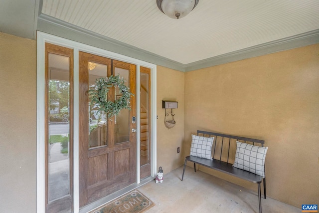 view of exterior entry with stucco siding