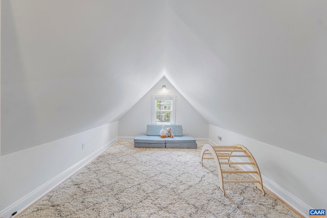 bonus room featuring carpet floors, vaulted ceiling, and baseboards