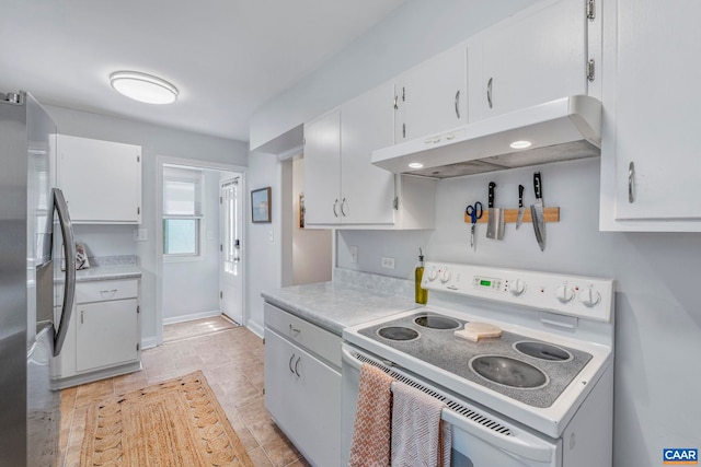 kitchen with white electric range oven, under cabinet range hood, freestanding refrigerator, light countertops, and white cabinets