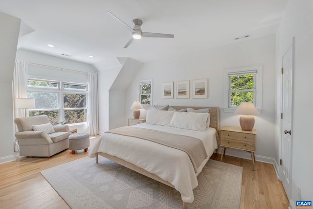 bedroom with light wood-style flooring, baseboards, a ceiling fan, recessed lighting, and lofted ceiling