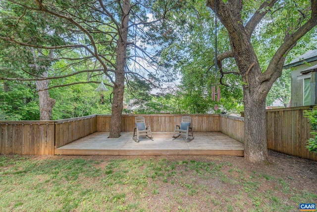 view of yard with a wooden deck and fence