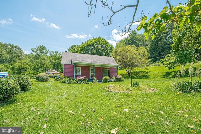  - view of front of property with a front lawn and covered porch