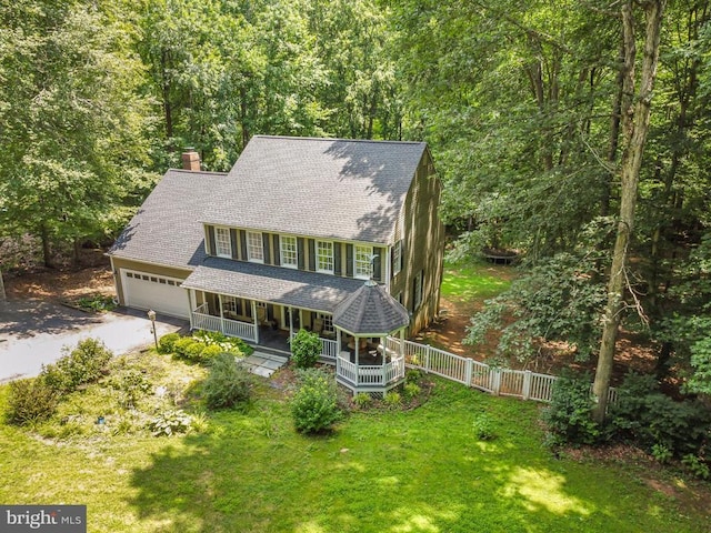9603 Conaty Cir, Spotsylvania, VA 22553 - view of front facade with a porch, a chimney, a shingled roof, a garage, and driveway