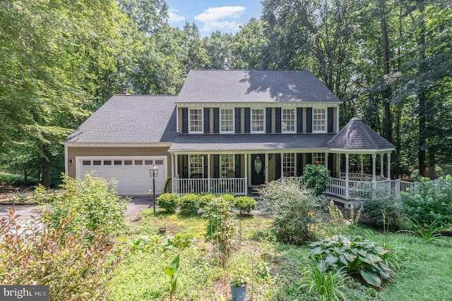 9603 Conaty Cir, Spotsylvania, VA 22553 - colonial-style house featuring a porch, a garage, driveway, and a chimney