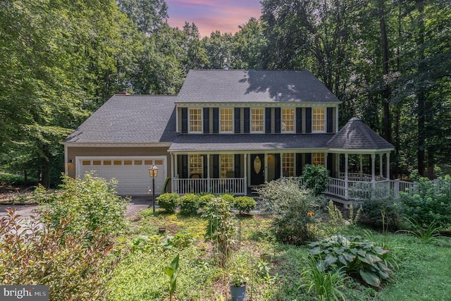 9603 Conaty Cir, Spotsylvania, VA 22553 - colonial inspired home with covered porch, a garage, asphalt driveway, and a chimney