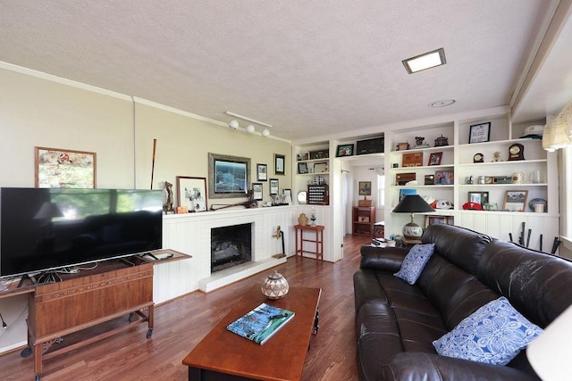 1601 Brunswick Rd, Waynesboro, VA 22980 - living room featuring ornamental molding, a textured ceiling, wood finished floors, and a brick fireplace