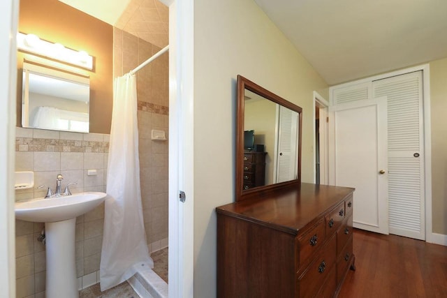 1601 Brunswick Rd, Waynesboro, VA 22980 - bathroom featuring a closet, tiled shower, tile walls, and wood finished floors