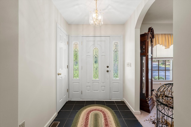 5409 Smith Creek Rd, New Market, VA 22844 - entrance foyer with arched walkways, dark tile patterned flooring, and a chandelier