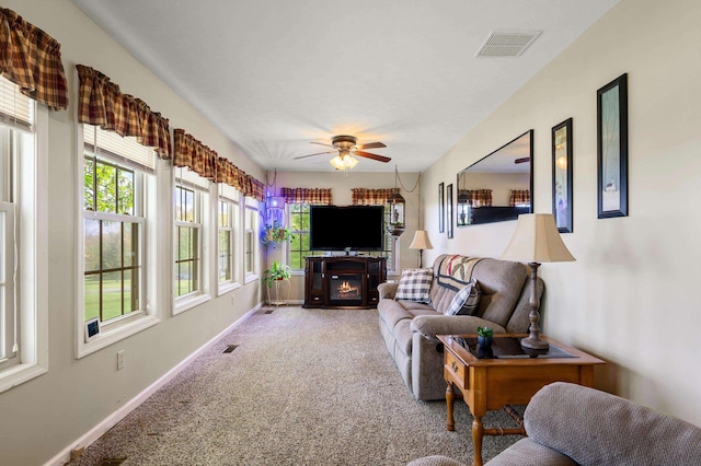 5409 Smith Creek Rd, New Market, VA 22844 - carpeted living area featuring ceiling fan and a glass covered fireplace