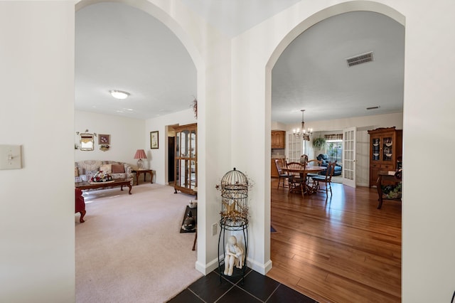 5409 Smith Creek Rd, New Market, VA 22844 - hall featuring arched walkways, a chandelier, and dark tile patterned flooring