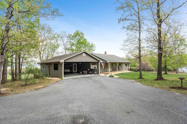 5409 Smith Creek Rd, New Market, VA 22844 - single story home featuring a front yard, asphalt driveway, a chimney, and covered porch