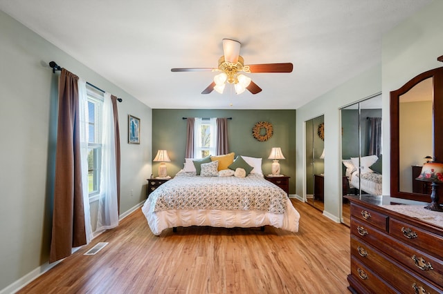5409 Smith Creek Rd, New Market, VA 22844 - bedroom with two closets, light wood finished floors, and a ceiling fan