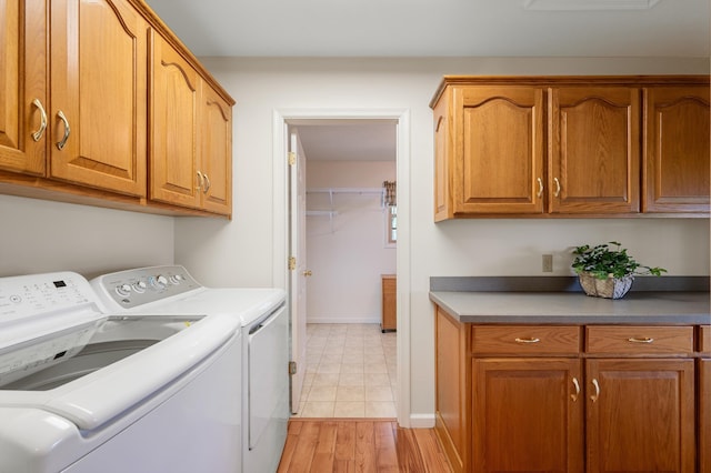 5409 Smith Creek Rd, New Market, VA 22844 - laundry room featuring washer and clothes dryer, cabinet space, and light wood finished floors