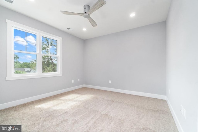 empty room with carpet, baseboards, a ceiling fan, and recessed lighting