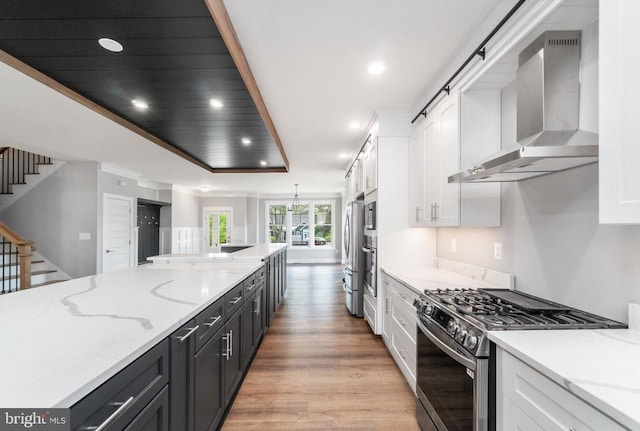 3200 Lakeview Pkwy, Locust Grove, VA 22508 - kitchen featuring wall chimney range hood, stainless steel appliances, white cabinets, light wood-style floors, and recessed lighting