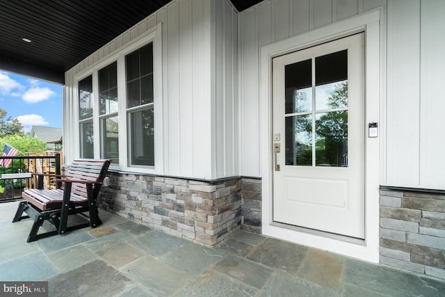 3200 Lakeview Pkwy, Locust Grove, VA 22508 - entrance to property with covered porch, stone siding, and board and batten siding