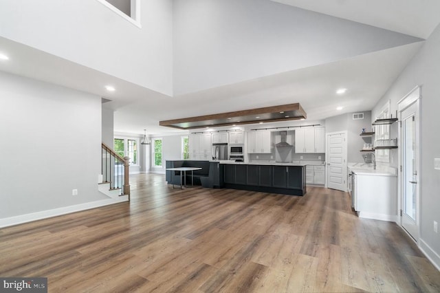 3200 Lakeview Pkwy, Locust Grove, VA 22508 - unfurnished living room featuring recessed lighting, wood finished floors, a sink, baseboards, and a chandelier