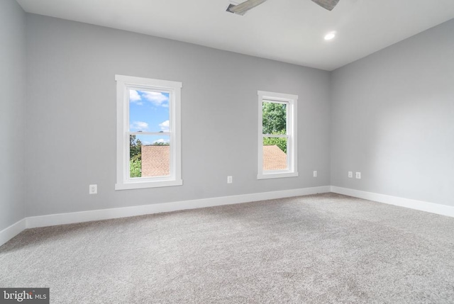 spare room featuring carpet flooring, baseboards, a ceiling fan, and recessed lighting