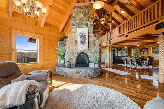 928 Melrose Rd, Rockingham, VA 22802 - living room featuring wood ceiling, ceiling fan with notable chandelier, beam ceiling, a fireplace, and hardwood / wood-style floors
