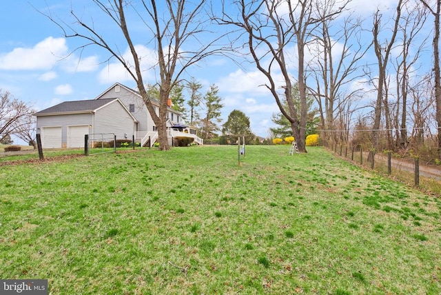 view of yard featuring a garage