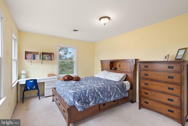 bedroom with light colored carpet