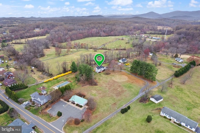 view of property location with a mountainous background and rural landscape