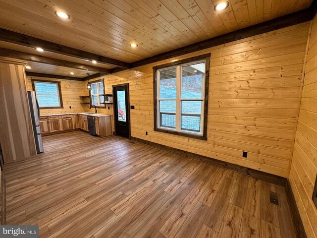 152 Susan Ln, Stanley, VA 22851 - kitchen featuring freestanding refrigerator, light countertops, wooden walls, wood finished floors, and recessed lighting