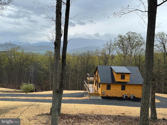 152 Susan Ln, Stanley, VA 22851 - view of front of house with a mountain view, a view of trees, metal roof, and central AC unit