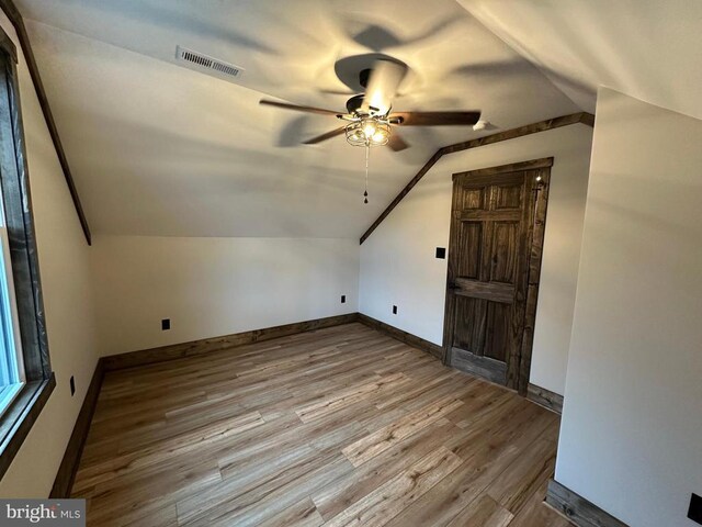 152 Susan Ln, Stanley, VA 22851 - additional living space with lofted ceiling, wood finished floors, ceiling fan, and baseboards