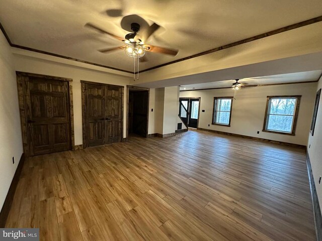 152 Susan Ln, Stanley, VA 22851 - unfurnished living room with a ceiling fan, wood finished floors, and baseboards