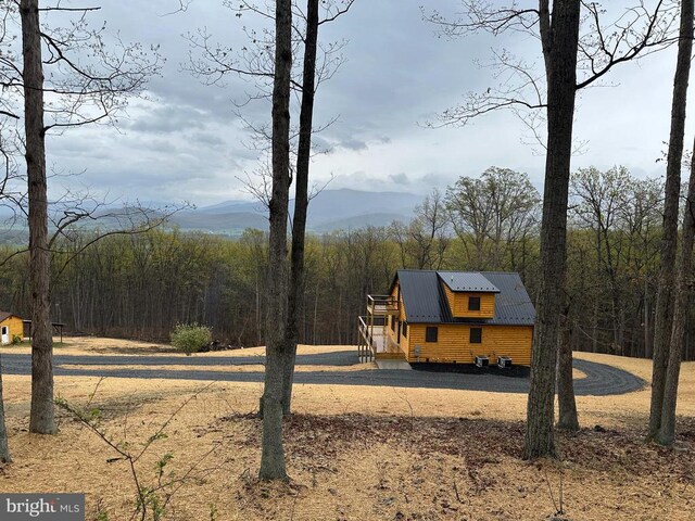 152 Susan Ln, Stanley, VA 22851 - view of front of house with a wooded view, metal roof, and a mountain view