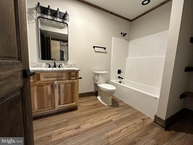 152 Susan Ln, Stanley, VA 22851 - full bathroom featuring toilet, wood finished floors, vanity, ornamental molding, and bathtub / shower combination