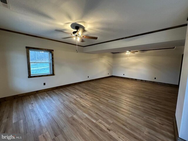152 Susan Ln, Stanley, VA 22851 - unfurnished room with ceiling fan, wood finished floors, ornamental molding, and baseboards